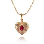 Celestial Ruby and Diamond Starburst Heart Pendant in 18k Yellow Gold