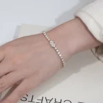 Classic Round Moissanite Tennis Bracelet Featuring Marquise Cut Floral Clasp