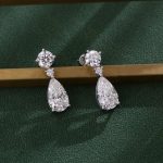 Two Stone:White Gold Round Cut and Pear Cut Moissanite Drop Earrings