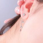 Enchanting White Gold round cut Moissanite Dangling Earrings