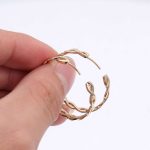 Gorgeous Yellow Gold Moissanite Twisted Hoop Earrings