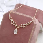 Elegant Pear Cut Moissanite Pendant Necklace with Nature Inspired Vine Design