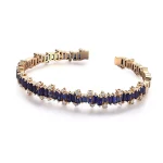 Baguettes Cut Lab Sapphire Bangle Bracelet with Shimmering Round Moissanite Accent
