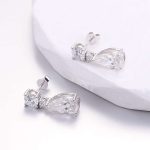 Two Stone:White Gold Round Cut and Pear Cut Moissanite Drop Earrings
