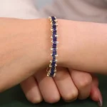 Baguettes Cut Lab Sapphire Bangle Bracelet with Shimmering Round Moissanite Accent