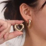 Heart Shaped Hoop Earring with Shimmering Round Cut Moissanite Accent