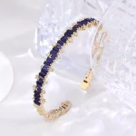 Baguettes Cut Lab Sapphire Bangle Bracelet with Shimmering Round Moissanite Accent