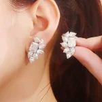 Emerald and Pear Cut Moissanite Cluster Stud Earrings with Modern Design