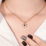 Celestial Ruby and Diamond Starburst Heart Pendant in 18k Yellow Gold