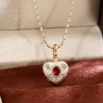Celestial Ruby and Diamond Starburst Heart Pendant in 18k Yellow Gold
