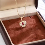 Celestial Ruby and Diamond Starburst Heart Pendant in 18k Yellow Gold