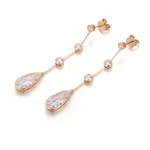 Linear Pear and Round Moissanite Drop Earrings with Bezel Accents
