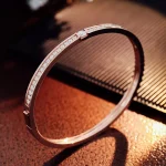 Sleek Channel Set Round Cut Moissanite Rigid Bangle Bracelet