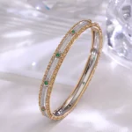 Dual-Tone Emerald Bracelet | Round-Cut Emeralds in 18K Yellow & White Gold​