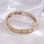 Dual-Tone Emerald Bracelet | Round-Cut Emeralds in 18K Yellow & White Gold​