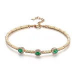 ​Emerald Halo Link Bracelet | Oval-Cut Emerald & Lab Diamond Halo Bracelet in 18K Yellow Gold​