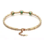 ​Emerald Halo Link Bracelet | Oval-Cut Emerald & Lab Diamond Halo Bracelet in 18K Yellow Gold​