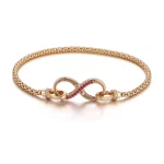 Two-Sided Infinity Buckle Pendant | 18K Gold Infinity Symbol with Lab Diamond & Ruby Sides