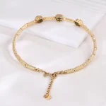 ​Emerald Halo Link Bracelet | Oval-Cut Emerald & Lab Diamond Halo Bracelet in 18K Yellow Gold​