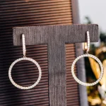 Round Cut Moissanite Drop Earrings Linear Graduated Dangle Style