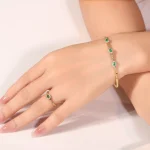 ​Emerald Halo Link Bracelet | Oval-Cut Emerald & Lab Diamond Halo Bracelet in 18K Yellow Gold​