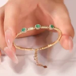 ​Emerald Halo Link Bracelet | Oval-Cut Emerald & Lab Diamond Halo Bracelet in 18K Yellow Gold​
