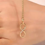 Two-Sided Infinity Buckle Pendant | 18K Gold Infinity Symbol with Lab Diamond & Ruby Sides