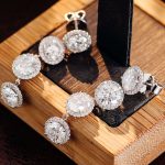 round moissanite halo linear earrings