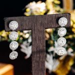 round moissanite halo linear earrings