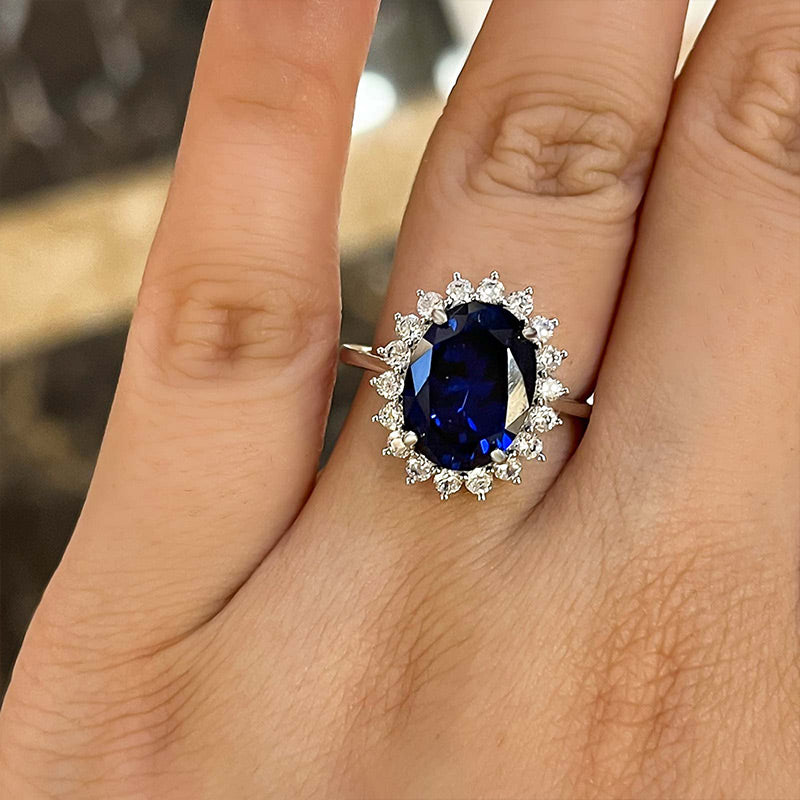 IMG-6904 S925 Luxurious Halo Oval Cut Blue Sapphire Engagement Ring In Sterling Silver - Image 1