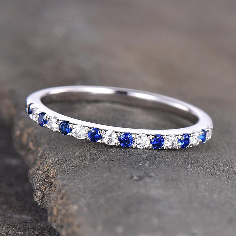 WB244-2 S925 Half Eternity Blue And White Sapphire Wedding Band For Women In Sterling Silver - Image 1
