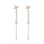 Long Linear Round Cut Moissanite Drop Earrings with Star Motifs
