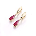 **Captivating Yellow Gold Pear Cut Red Lab Gemstone Drop Earrings - Image 2