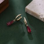 **Captivating Yellow Gold Pear Cut Red Lab Gemstone Drop Earrings - Image 6