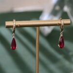 **Captivating Yellow Gold Pear Cut Red Lab Gemstone Drop Earrings - Image 8