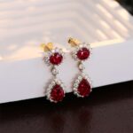 **Stunning Yellow Gold Round and Pear Cut Red Lab Gemstone Drop Earrings - Image 4