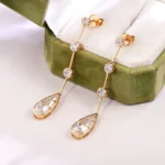 *Linear Pear and Round Moissanite Drop Earrings with Bezel Accents - Image 4