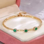 ​Emerald Halo Link Bracelet | Oval-Cut Emerald & Diamond Halo Bracelet in 18K Yellow Gold​ - Image 4