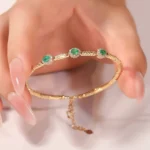 ​Emerald Halo Link Bracelet | Oval-Cut Emerald & Diamond Halo Bracelet in 18K Yellow Gold​ - Image 8
